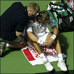Juan Carlos Ferrero receives treatment for injury