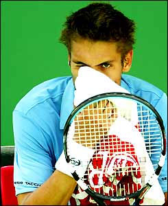 Nicolas Escude looks despondent during his defeat to Robby Ginepri