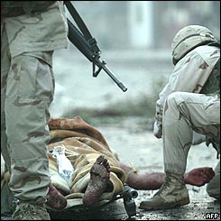 American troops give medical treatment to a man injured in the blast 