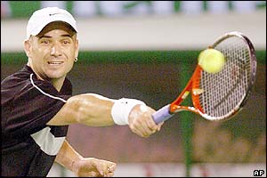 Andre Agassi plays a forehand return