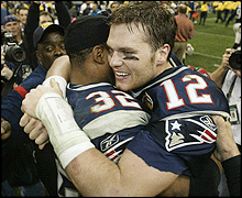 Tom Brady celebrates New England's triumph with Antowain Smith
