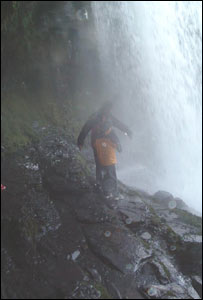 Joseph (10) Millie (seven) and their dad Stuart Earp behind the waterfall at Sqwd Yr Eira near Ystradfellte in the Beacons National Park January 2004.