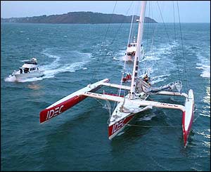 Joyon aboard IDEC is escorted into Brest harbour