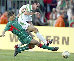 Algeria's Chrerrad Abdelmalek duels with Morocco's Talal El Kourkouli 