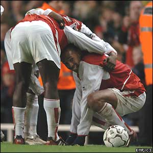 Thierry Henry (right) is congratulated after scoring Arsenal's second goal