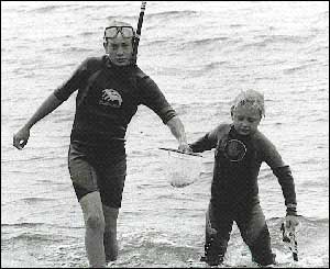 Jacqueline Filby's son Jamie visiting from New Mexico USA with his young cousin William snorkelling around Criccieth Beach