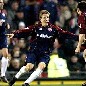 Juninho scores twice in four minutes as Boro take a 2-1 lead into the interval at Old Trafford