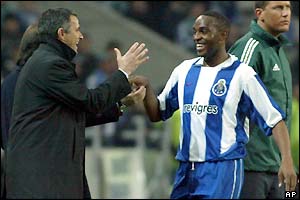 Porto coach Jose Mourinho congratulates goalscorer Benni McCarthy 