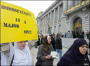 Ariel Zitoun of San Francisco, left, and other members of the Al-Sabeel Islamic group, protest against same-sex marriages outside City Hall in San Francisco