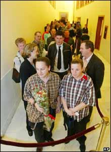 Ruth Schneider (L) and Michele Johnson (R) queue to receive a marriage license