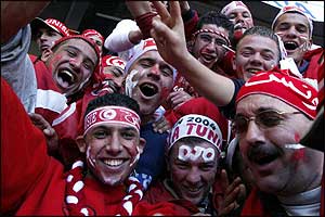 Tunisia fans wear their team's colours with pride