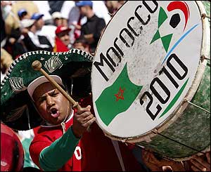 A musical fan cheers on Morocco ahead of the final