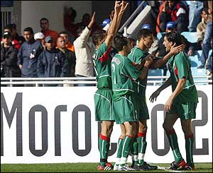 Youssef Hadji is congratulated by team-mates