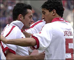 Dos Santos congratulates Jaziri on scoring the second goal