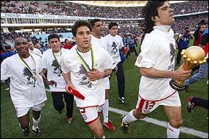 The ecstatic team wear their medals with pride