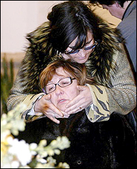 Pantani's mother, Tonina, cries in the arms of an unknown relative