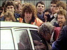Pickets confront a miner trying to return to work