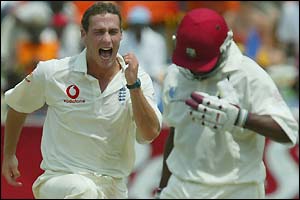 Simon Jones celebrates taking the scalp of Brian Lara