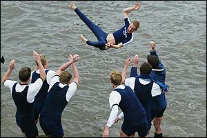 Cox Acer Nethercott is thrown into the water by his fellow victorious Oxford crewmates