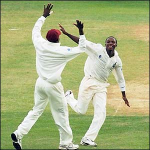 West Indies bowler Fidel Edwards celebrates the dismissal of Mark Butcher