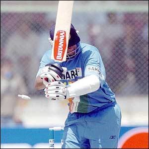 Rahul Dravid is India's top scorer but is bowled by Shoaib on 99