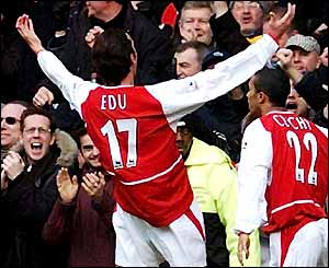 Arsenal's Edu celebrates in front of the Arsenal fans at Stamford Bridge