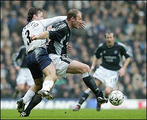 Newcastle's Alan Shearer and Mauricio Taricco of Spurs 