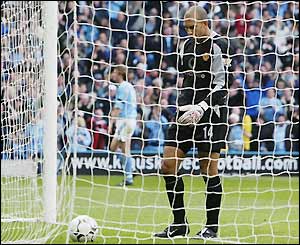 Man Utd keeper Tim Howard picks the ball out of the back of the net