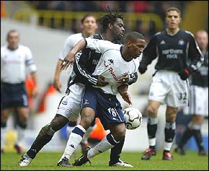 Olivier Bernard of Newcastle and Spurs' Jermain Defoe