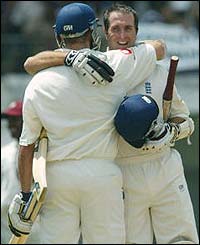 England's openers Marcus Trescothick and Michael Vaughan celebrate 