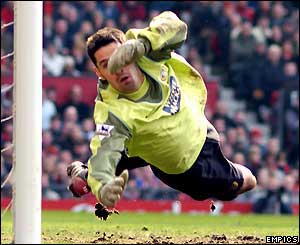 Scott Carson makes a diving save for Leeds