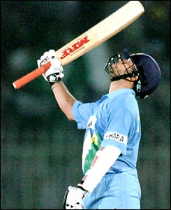 Sachin Tendulkar celebrates reaching his century against Pakistan