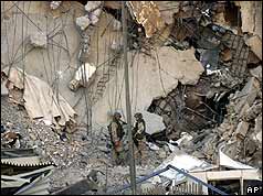 US soldiers inspecting the damage