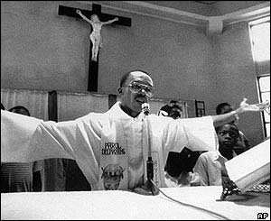 Aristide as priest in 1988