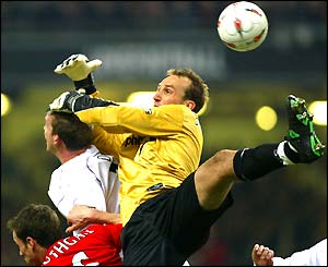 Mark Schwarzer challenges for the ball in the air