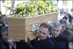 John Charles' coffin is carried into Leeds Parish Church