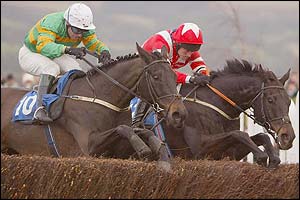 St Pirran (right) clears the last ahead of Ground Ball in the Grand Annual Chase