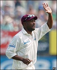 Brian Lara waves directions to his fielders