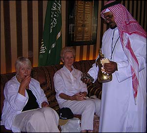 Sally Hanford (left) and Anne McIntyre are served tea in a traditional Bedouin tent 