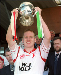 Cormac McAnallen lifts another piece of silverware