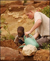 The 19-year-old prince and the four-year-old orphan plant a peach tree.