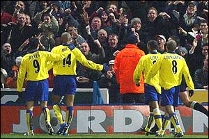 The Arsenal fans cheer the players' dazzling display