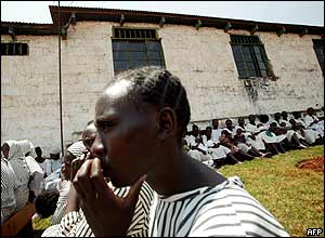 Women inmates sit outside their prison cells at the Langata womens prison in Nairobi.