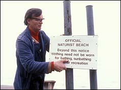 Sign warning of nudist beach