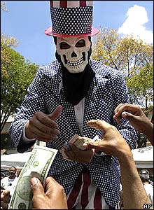 Venezuelan protester in a skull mask dressed as 