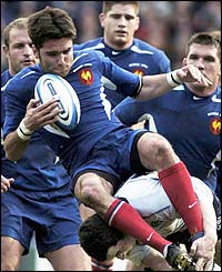 France's Dimitri Yachvili is stopped by Scotland's Derek Lee