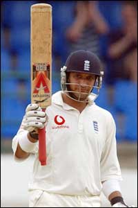 Mark Butcher celebrates reaching his half-century