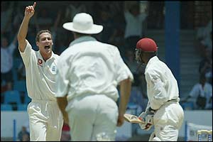 Simon Jones celebrates the wicket of Devon Smith 