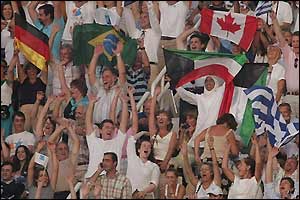 Fans from around the world wave their national flags