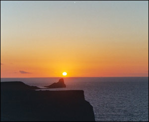 The sun setting behind the Worms Head, Gower (Joanna Walker, New York)